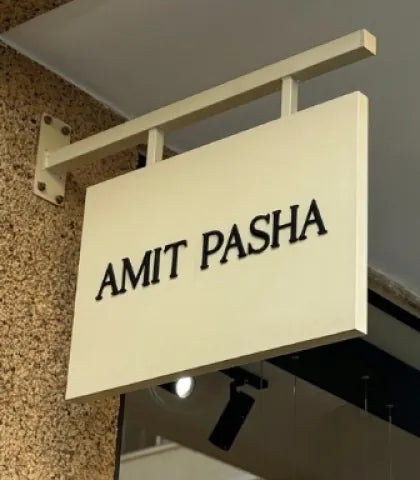 The Amit Pasha store sign